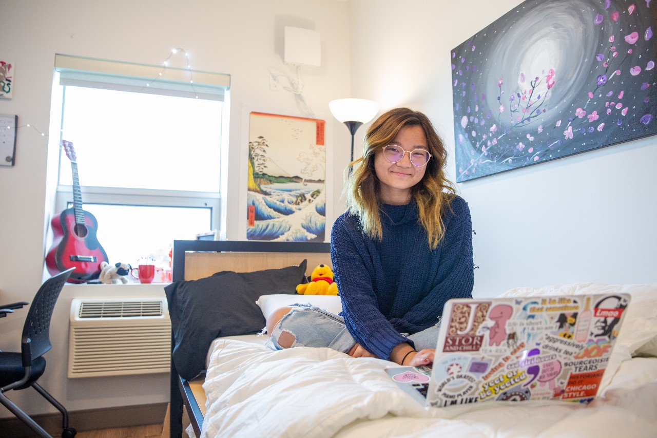 A female student in a Trent Durham dorm room.