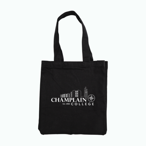 Champlain Black tote bag with Champlain towers and compass, text "Champlain Est. 1966"