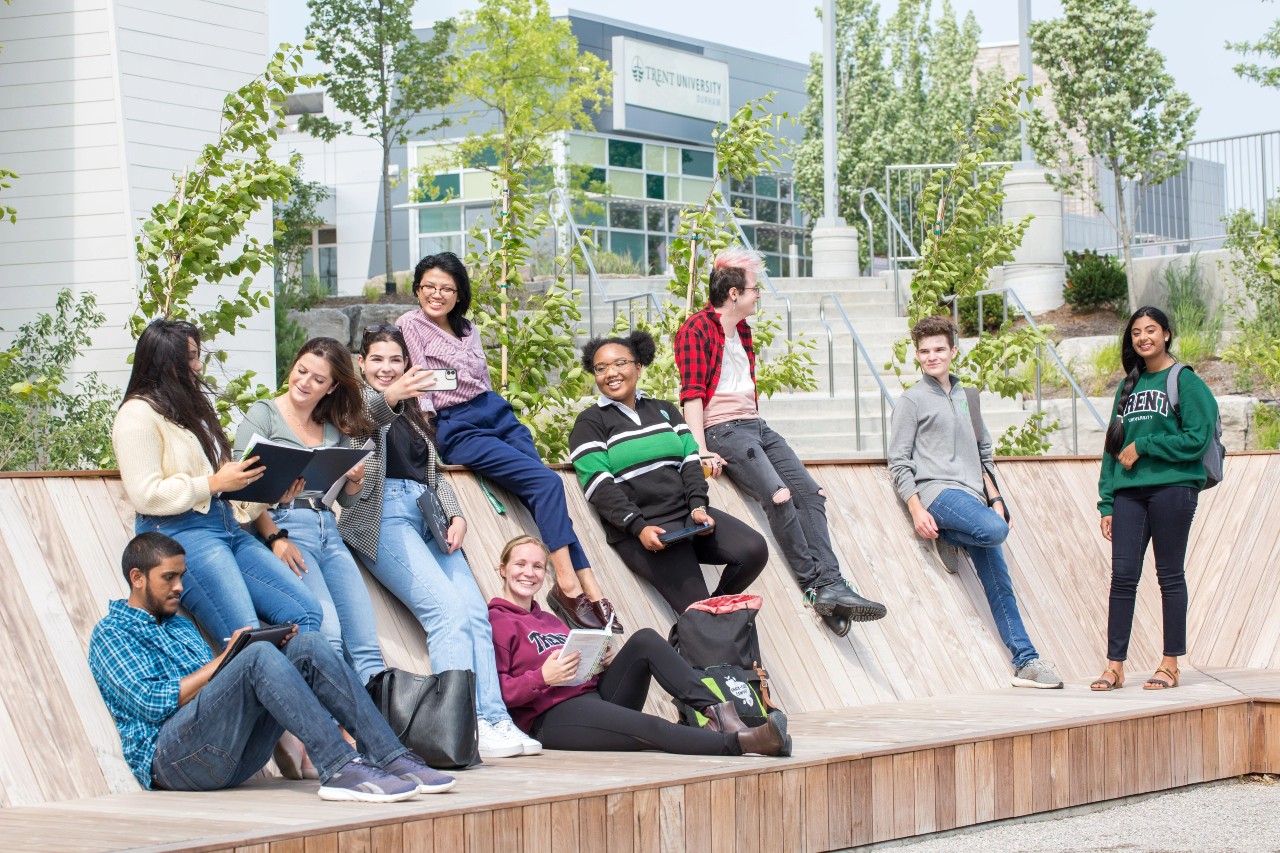 A group of students congregating outside Trent Durham Building A