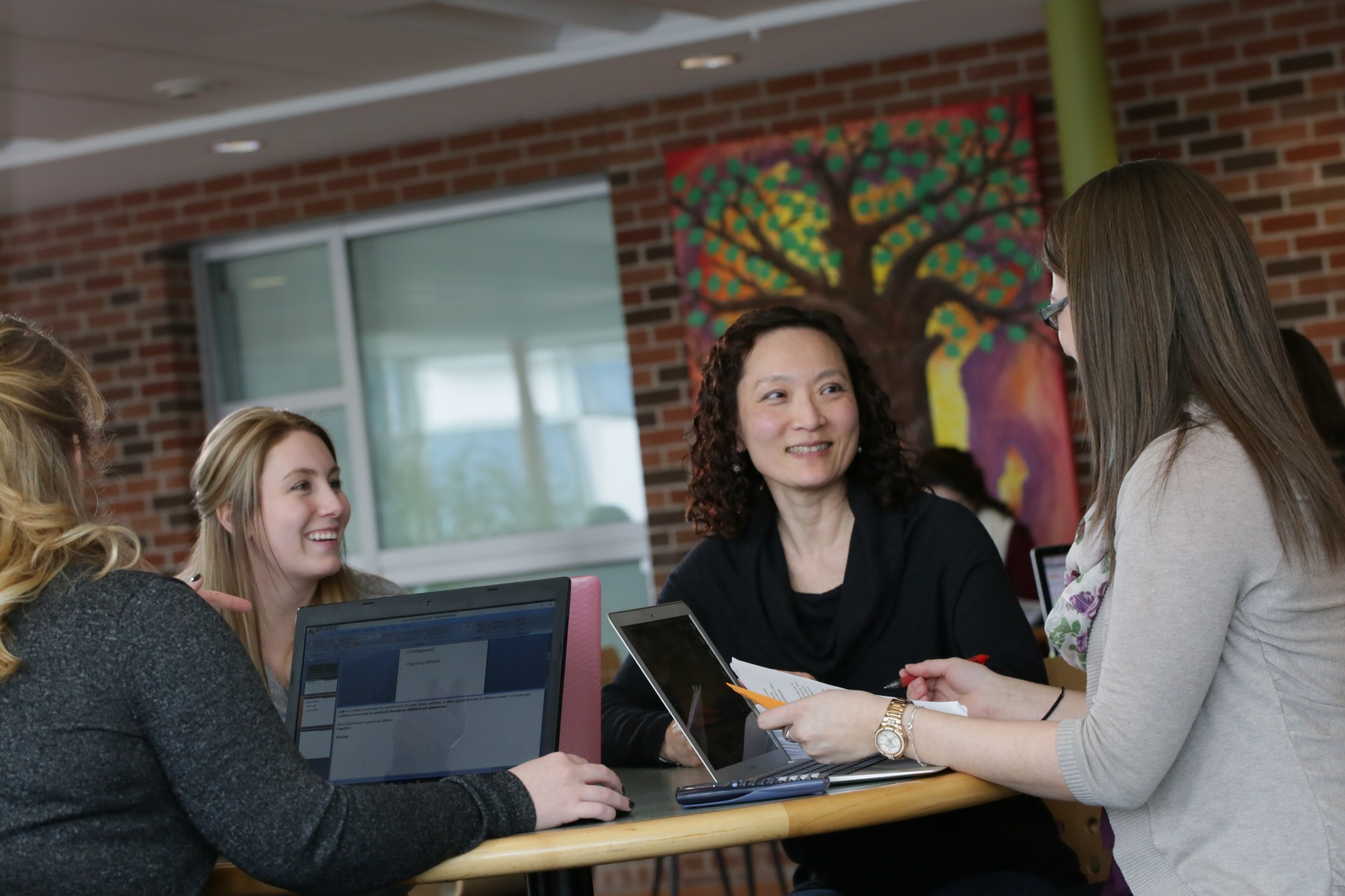 A professor meeting with students