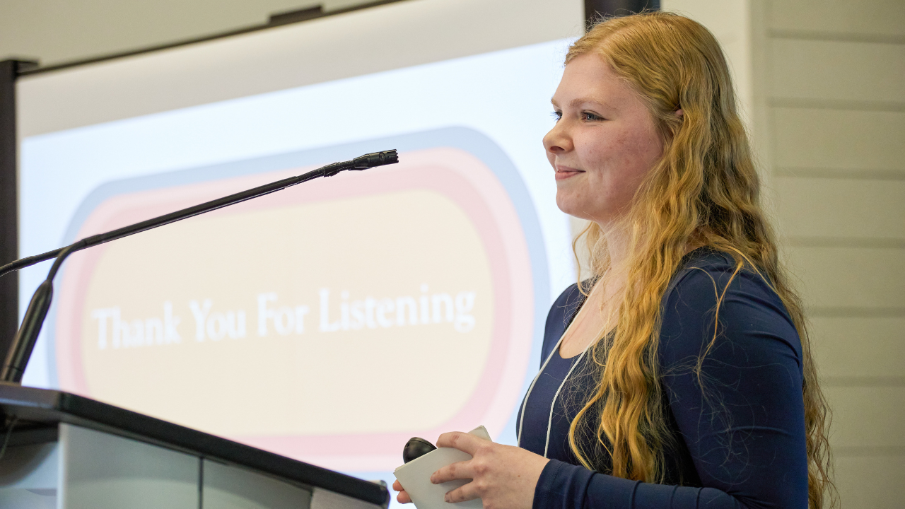 A student presenting to her class