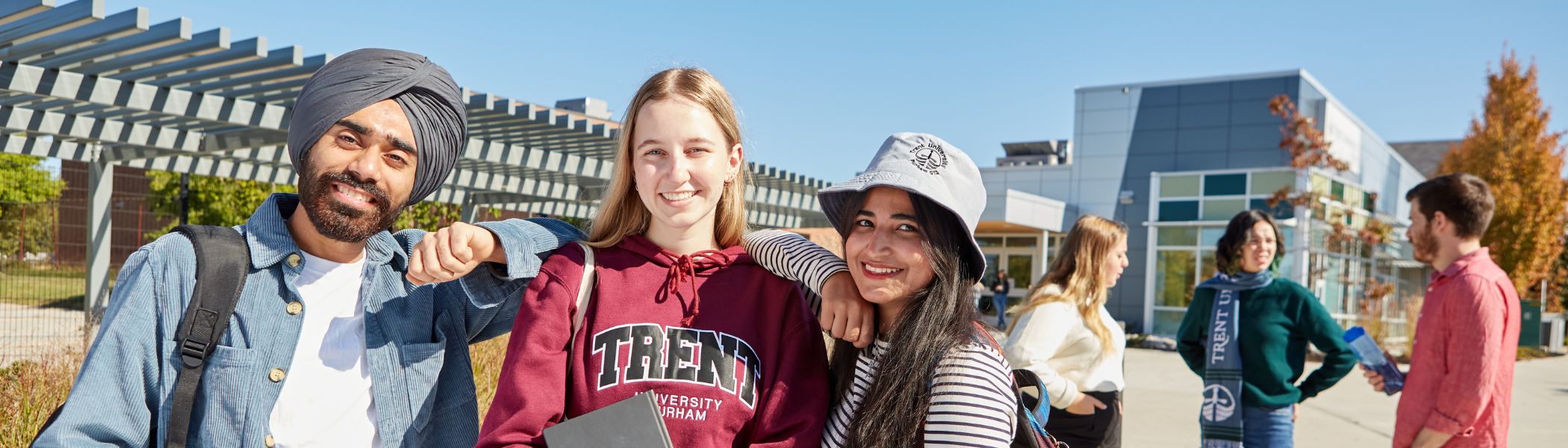 A group of Trent Durham students standing in front of Building A