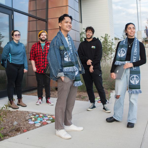 A group of students standing outside Building B