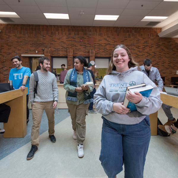 Student walking in the Trent Durham library