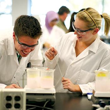 Two students working in a lab
