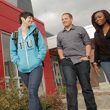 A group of students walking on the Trent Durham campus