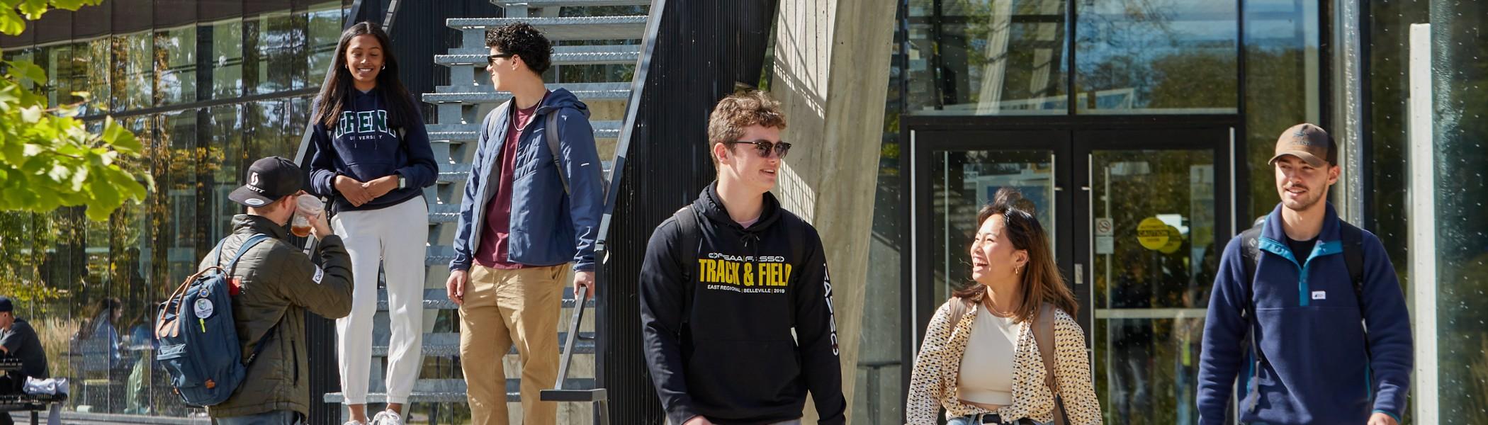 A group of students walking on the Trent campus
