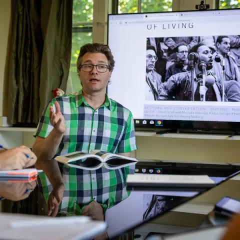 Professor lecturing students in seminar.