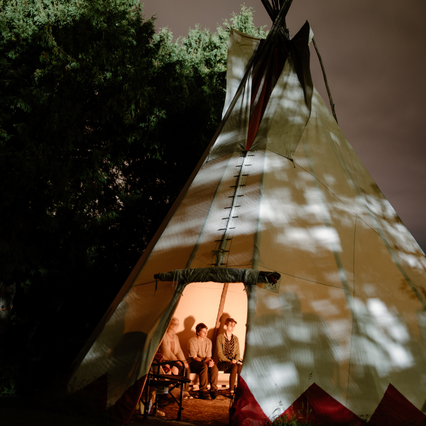 Students inside tipi.