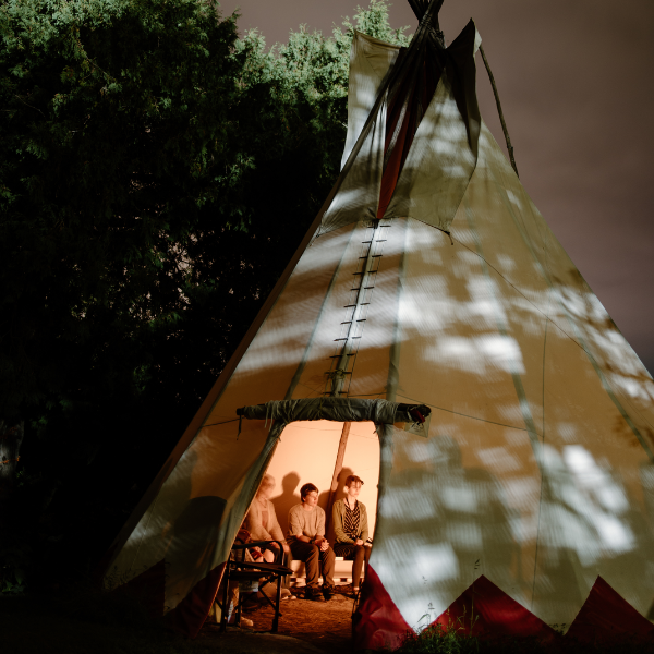 Students inside of tipi.