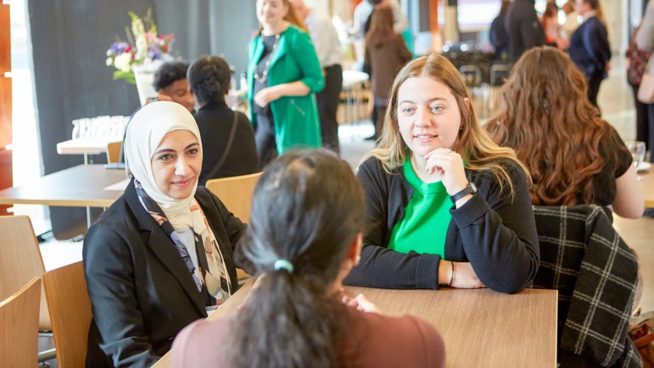 Three people having a conversation