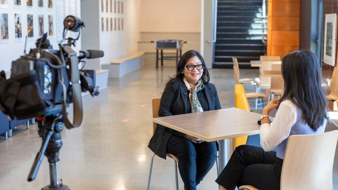 A journalism student conducting an interview