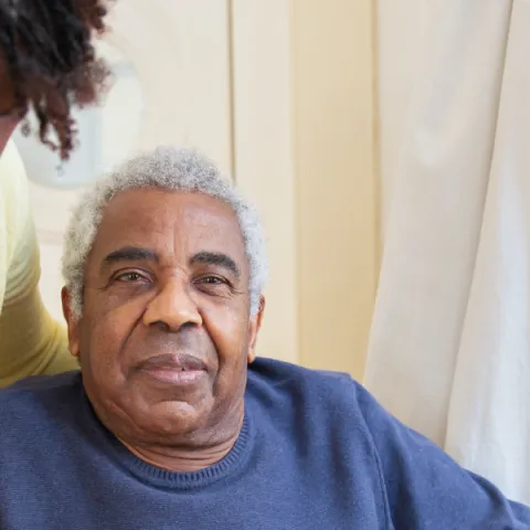 A nursing student helps care for a patient suffering from dementia