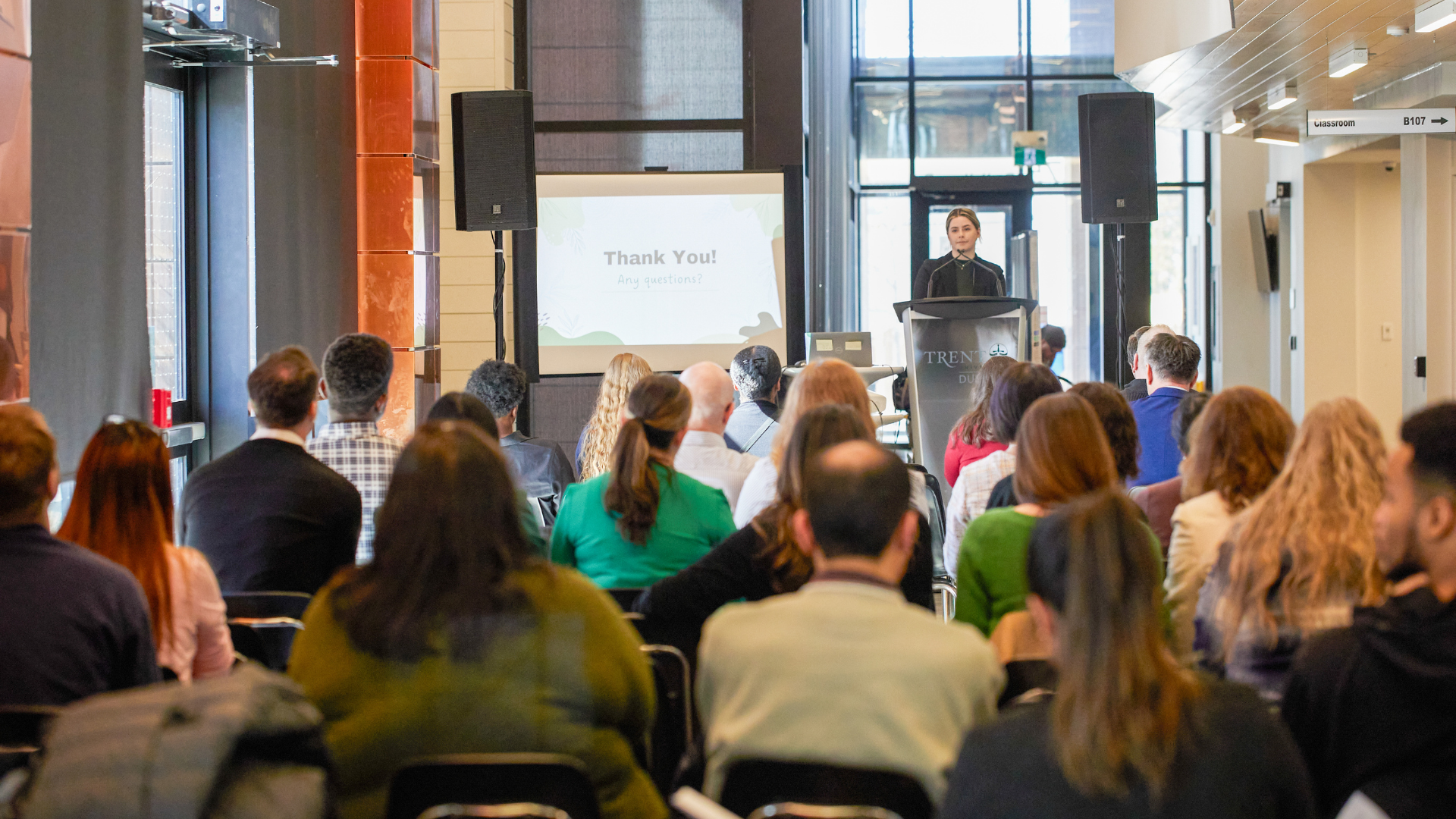 Student giving presentation in front of crowd