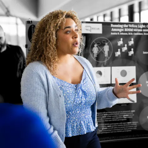 Trent University student giving a presentation about their research.