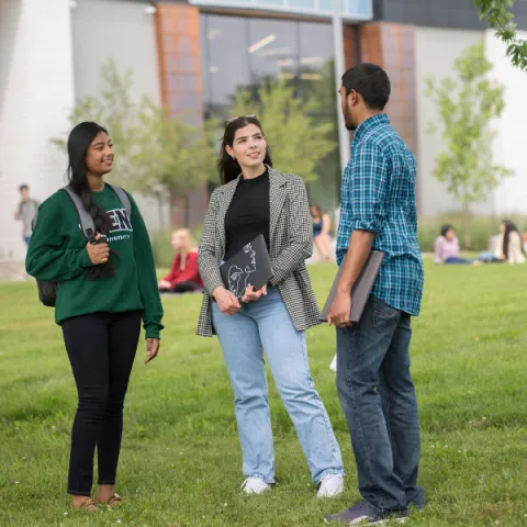 Three Trent University Durham students, talking outside.