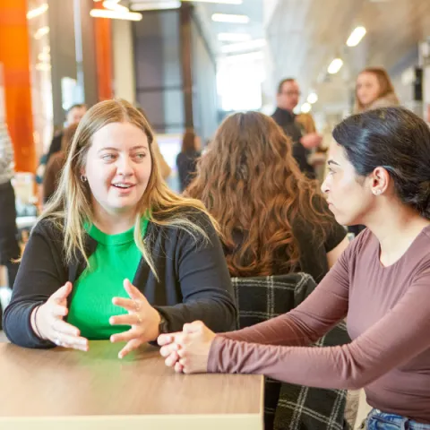 Trent University Durham students talking together.