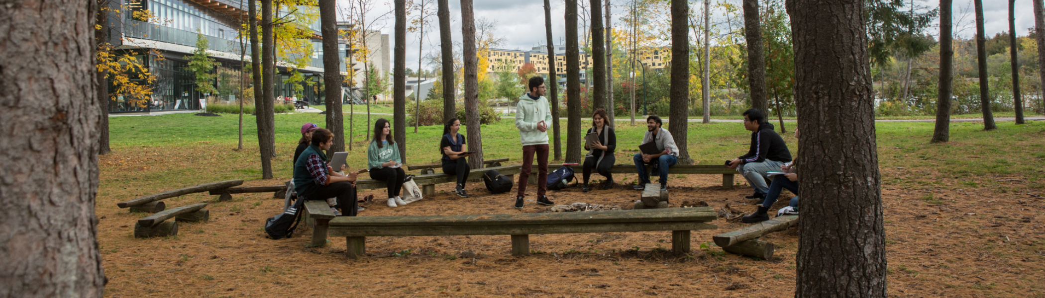 Students learning on the land, in outdoor classroom.