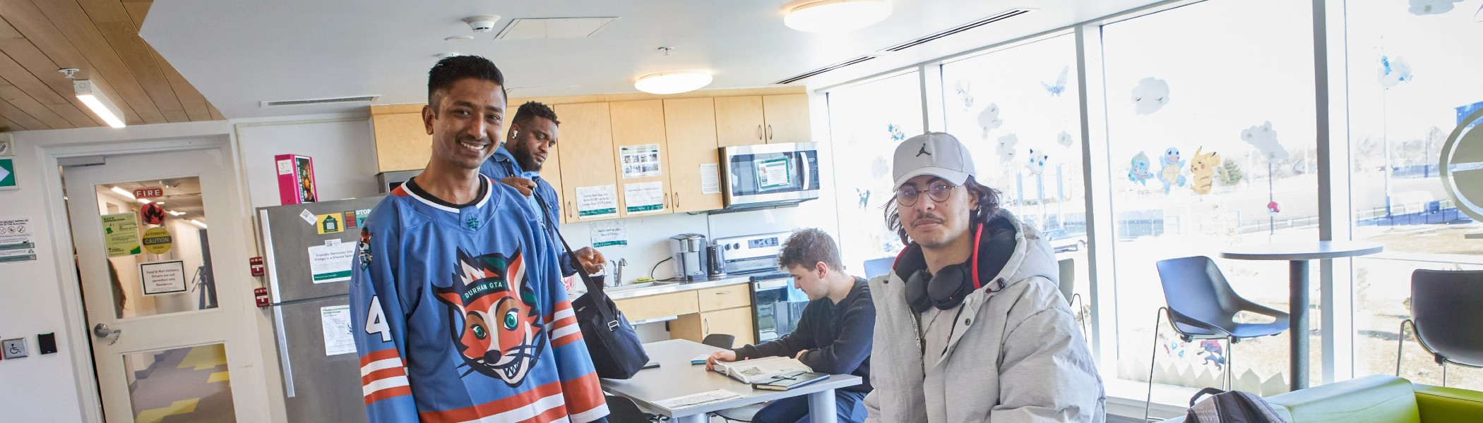 A group of students in a residence common area