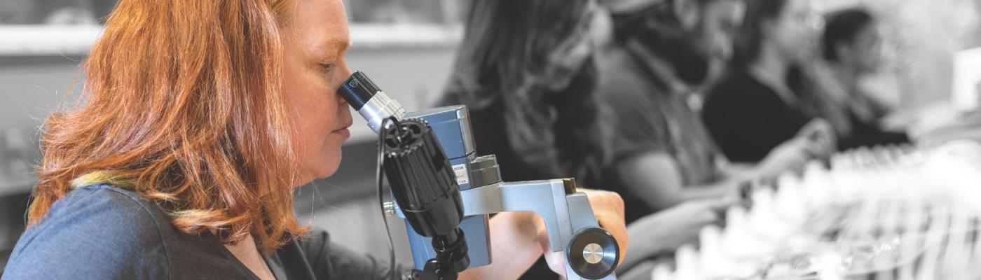 A student using a microscope