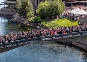 Graduating students standing on Faryon bridge