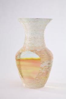 Vase like glass sculpture. Colour is hues of yellow, orange, and red
