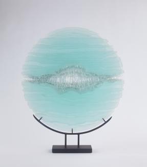 Round glass sculpture, light blue in colour