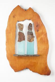 two sculptures made out of cast glass and mika stone, framed in wood.