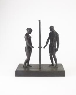 Figure of man and woman standing on either side of door. Sculpture made of bronze