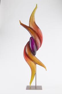 tall, abstract sculpture. colours are yellow, orange, red and purple