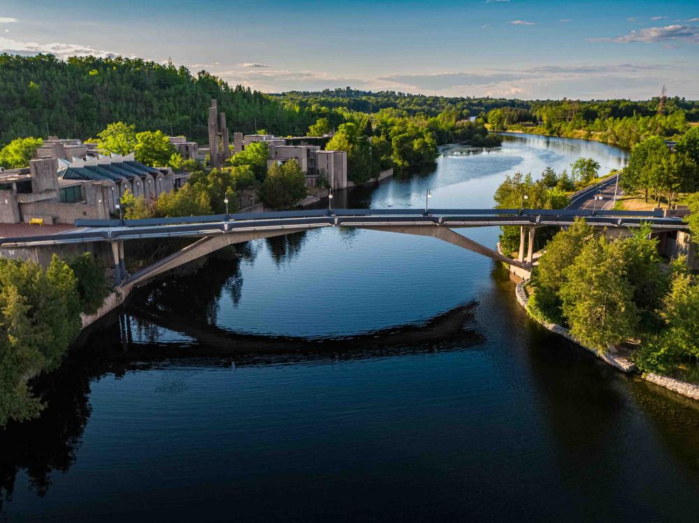 overview of the otonabee river and faryon bridge in summer.